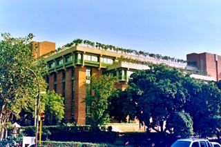 A building at a university that has trees planted on the roof. A building at a university that has trees planted on the roof.