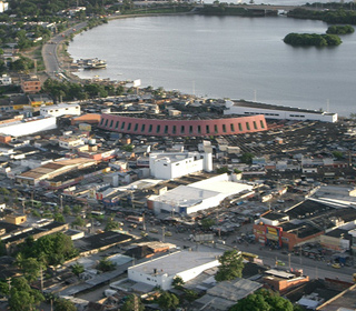 An aerial view of a marketplace by the water in Colombia. An aerial view of a marketplace by the water in Colombia.