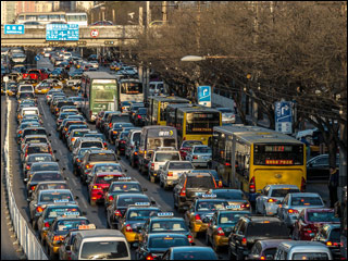 Cars lined bumper-to-bumper on highway. Cars lined bumper-to-bumper on highway.