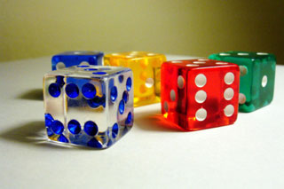 Five multicolored dice on a white background. Five multicolored dice on a white background.
