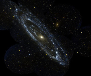 A blue spiral of stars form the Andromeda Galaxy set against a black background filled with multi-colored stars. A blue spiral of stars form the Andromeda Galaxy set against a black background filled with multi-colored stars.