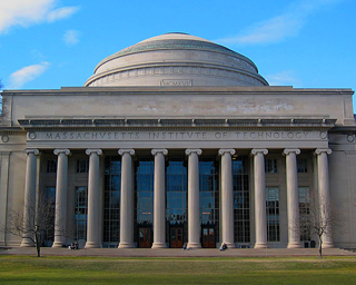 Building with ionic columns and large dome shown from a grassy courtyard. Building with ionic columns and large dome shown from a grassy courtyard.