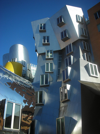 A building made of silver stainless steel, with walls that slope in angles and curves. A building made of silver stainless steel, with walls that slope in angles and curves.