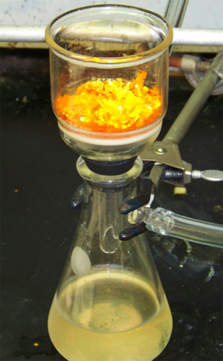 Conical flask with glass filter, secured by a lab clamp. Conical flask with glass filter, secured by a lab clamp.